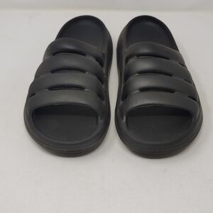 UGG Sport Yeah slip-on rubber flats in black.  Size W8